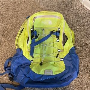 Blue and green North Face back pack.